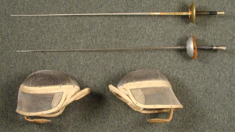 VINTAGE FENCING FOILS AND FENCING MASKS - 2 SETS: OFFERED HERE ARE TWO VINTAGE SETS OF FENCING FOILS AND FENCING MASKS. THE MASKS ARE MADE OUT OF A HEAVY METAL FACE PROTECTOR WITH CANVAS NECK PIECES AND WIDE RETAINER IN BACK. THE FENCING 