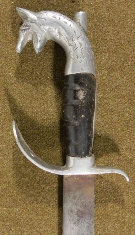 VINTAGE 25" SPANISH "BULL'S HEAD" MACHETE W/SILVER HILT: VINTAGE 25" SPANISH "BULL'S HEAD" MACHETE-HORN GRIPS-SILVER HILT * HAS PICADORE'S STAKE IN NECK--1 SIDE OF GRIP PARTIALLY DAMAGED *