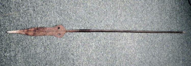 African Large Antique Hunting Throwing Spear 71 In.: This is a large African hunting throwing spear, and we believe it could date back 100 years or more. It has a long wooden shaft, carved roughly to a tip at the base. The grip has wrought copper wire b