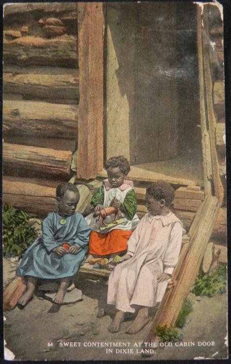 Antique Dixie Land Postcard Black Americana Children: This is an early color tinted postcard portraying three African American children playing with a toy horse. Numbered 64 and titled "Sweet Contentment " the card attempts to portray a happy life in the