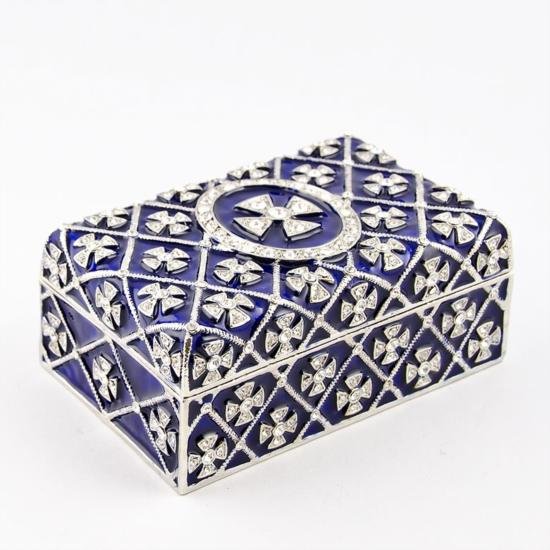 Faberge Trinket Jewelry Box: Faberge Trinket Jewelry Box. This jewelry box has blue translucent enamel under the crystal ornamentations in the form of crosses. Faberge?s superb enameling technique is regarded as one of his main c