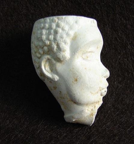 Early Clay Pipe depicting the head of Southern Slave: Early Clay Pipe depicting the head of Southern Slave during the 1840 to 1860 period. This pipe was unearthed at a tavern site in South Carolina and were most probably cast in the south and given to bi