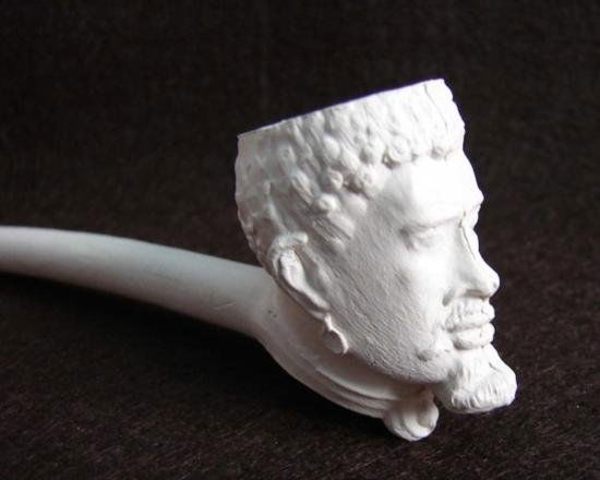 Early Clay Pipe depicting the head of Southern Slave: Early Clay Pipe depicting the head of Southern Slave during the 1840 to 1860 period. This pipe was unearthed at a tavern site in South Carolina and were most probably cast in the south and given to bi