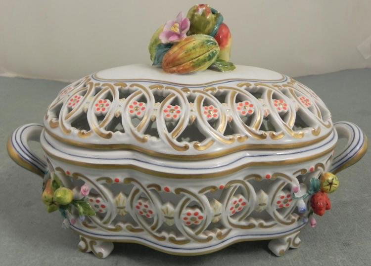 Bonwit Teller Italian Capodimonte Porcelain Basket: This is an Italian made porcelain lidded basket, with capodimonte style fruit and floral motifs, and gold painted trim. It was imported from Italy exclusively for Bonwit Teller department store, which