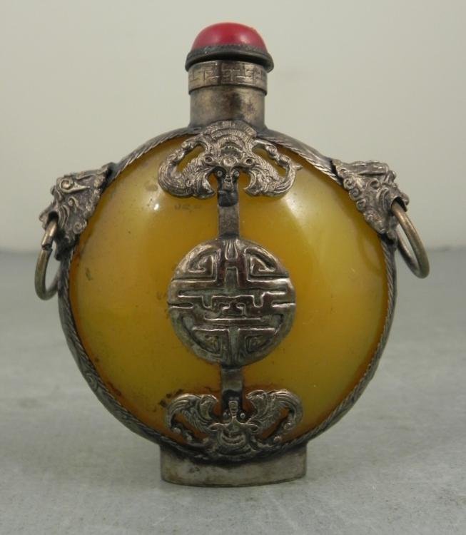 Antique Chinese Snuff / Perfume Bottle w/ Bats, Lions: This is an antique snuff or perfume bottle, with designs featuring bats and lion's heads with rings. It is yellow glass material with metal in nice details. The cap is red, with a wand with scoop. Its