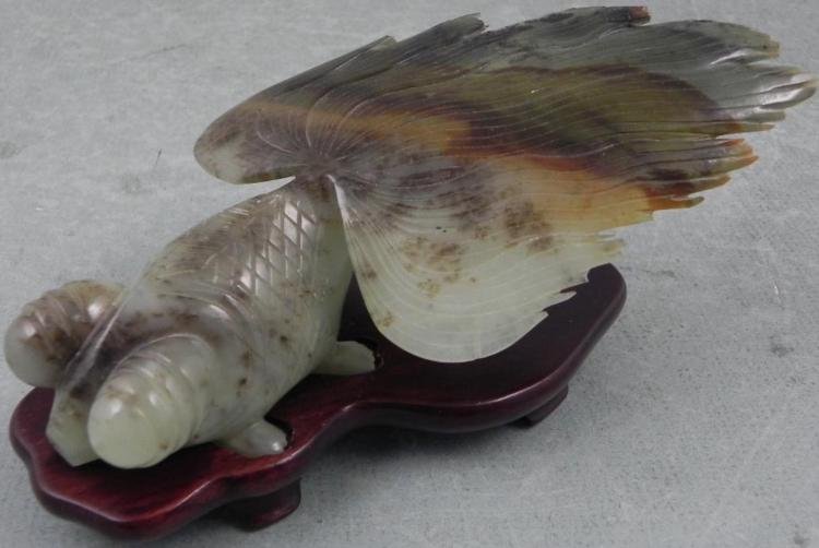 Hand Carved Marble Japanese Goldfish w/ Fan Tail: This Hand Carved goldfish is pale green marble, with natural stripes of brown in it wide fan tail. The carving is nicely detailed. The fish is 5 1/2" from hea d to tail. It fits on the separate wooden