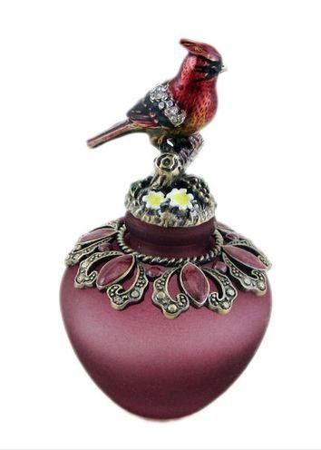 Perfume Bottle: Collectible red cardinal bird perfume bottle bejeweled top and base. Vintage style colored purple.