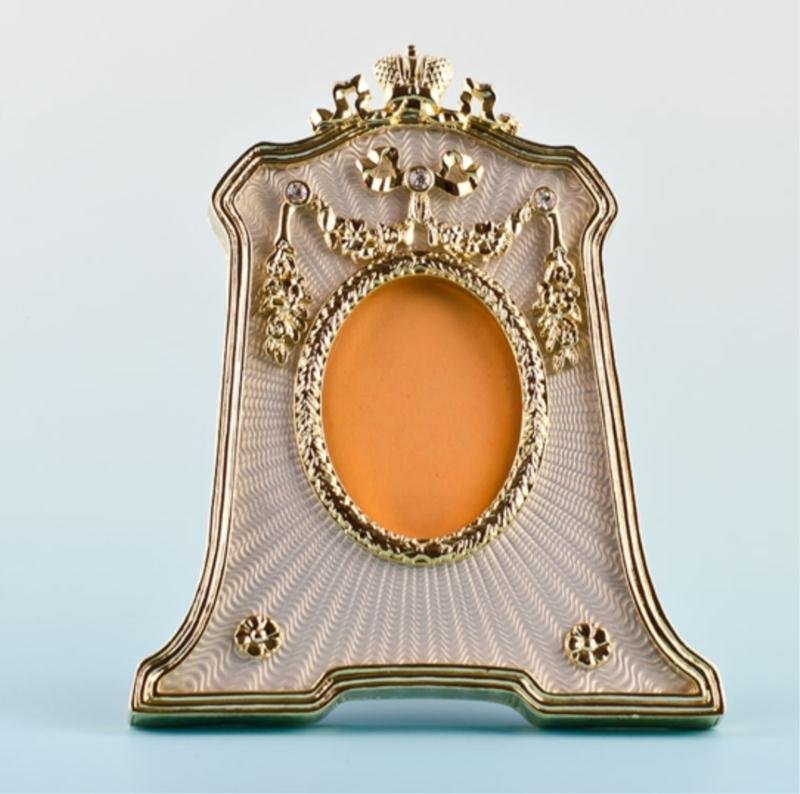 Silver Enameled Faberge Picture Frame: Silver Enameled Faberge Picture Frame This silver guilloche enameled photo frame contains golden garlands suspended from elegant crystals, the top of which is a ribbon cresting. This is a replica 