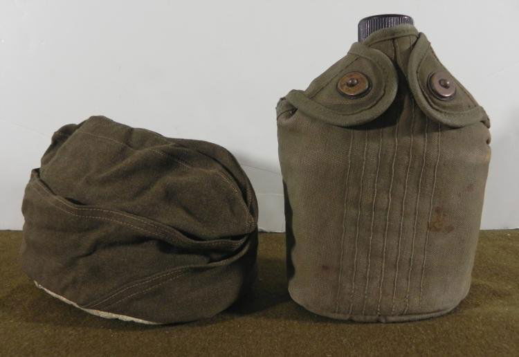 COMPLETE WWII US CANTEEN & HOLDER (ID'D) AND FIELD CAP: COMPLETE WWII US CANTEEN &HOLDER (ID'D) AND FIELD CAP CANTEEN IS COMPLETE AND COVER BOTTOM NAMED TO A SERVICE BATTERY