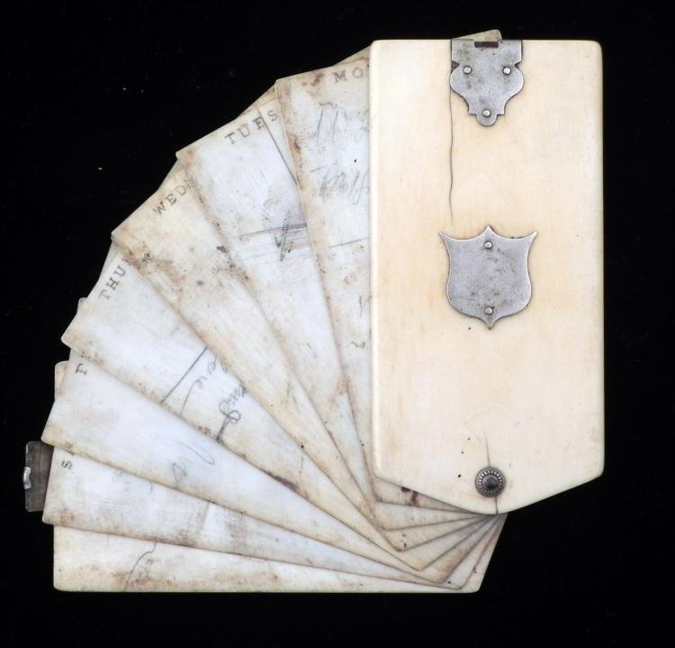 Antique Ivory Day Planner Ladies Purse Accessory: This is an antique day planner, with what appears to be ivory covers, and celluloid sheets that fan out. The front cover has a metal escutcheon and latch at the end, along with pin from where everythi
