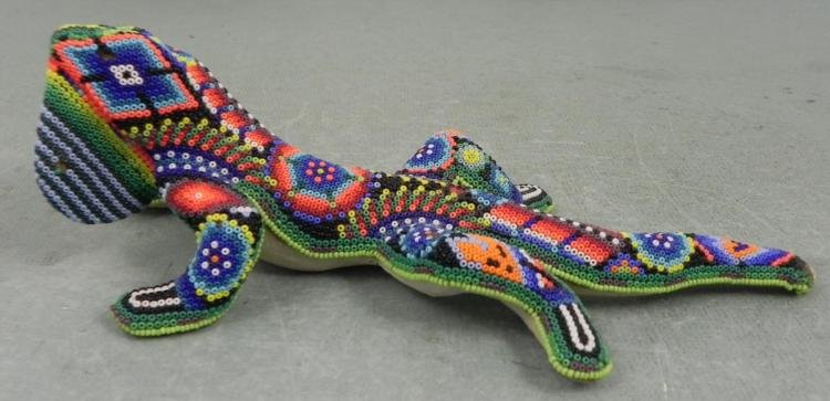 Handmade Colorful Beaded Lizard Figurine 7660: This lizard required a lot of patient beadworking to get this colorful and varied pattern covering the top of its body. * Composition: Clay with glued on beads * Markings: 7660 written on the bottom *