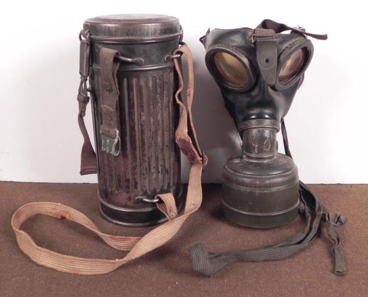 NAZI MILITARY GASMASK AND CANNISTER ORIGINAL 1942 WWII: NAZI MILITARY GASMASK AND CANNISTER-ALL STRAPS PRESENT-ORIGINAL-DATED 1942 * MASK MARKED "2"--CANNISTER MARKED "FE 42"--INSIDE MAKER MARKED "AB"--COMPLETE WITH ALL STRAPS AND IN VERY GOOD ORIGINAL CON
