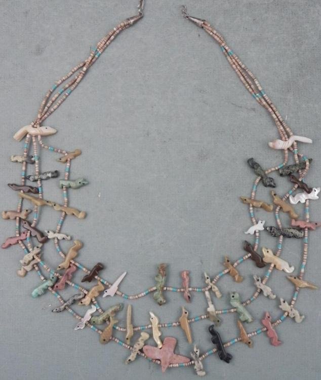 Fanciful Lizard & Fish Carved Stone Figurines Necklace: This necklace is made up of carved lizards and some fish, out of marble, mother of pearl, and various pastel colored stones. There are also tiny beads in various shades of tan and light blue. It is 24