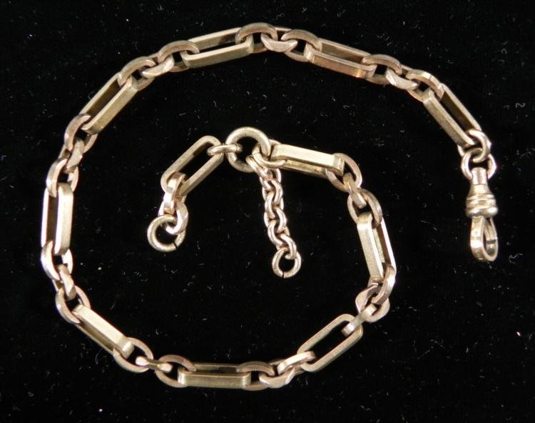 HDM & Co. Vintage/Antique Pocket Watch Chain Gold Tone: This vintage pocket watch chain has long, oval and faceted square shaped linksin gold tone. The HDM & Co. maker name is marked on the lobster claw closure. A bit of extra chain is near one end. Th