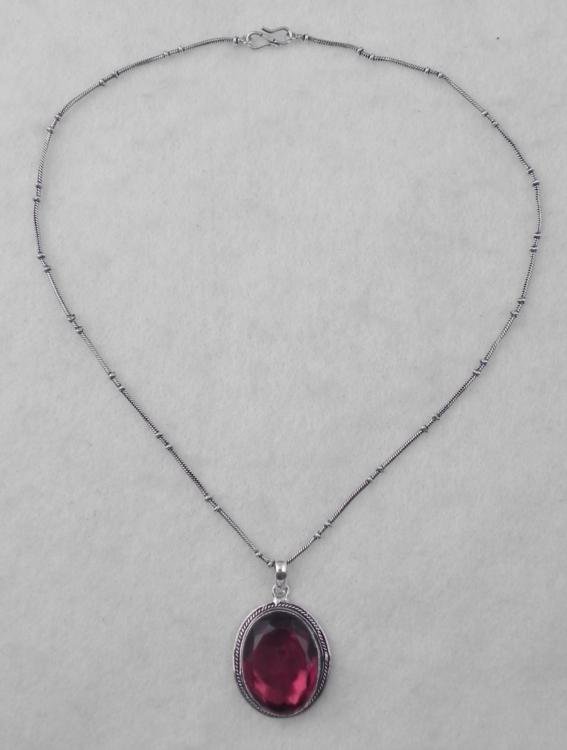 Ruby Sterling Oval Pendant Necklace: Sterling Pendant Necklace * Gemstone: Ruby in oval shape Pendant: 25 x 32 mm stone, on sterling setting with beaded sunburst border, on 20" chainCondition: Excellent