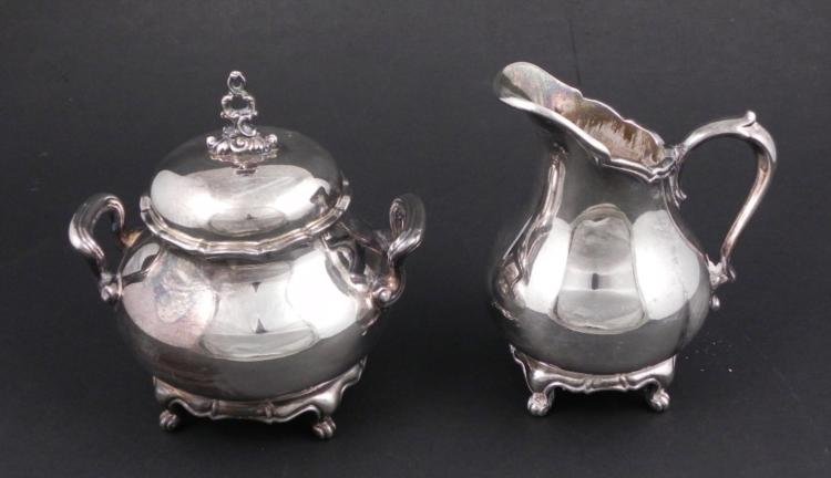 Reed & Barton Provincial Silver Plt Creamer, Sugar 7040: This Reed & Barton silver plated creamer and sugar bowl have a traditional pattern and cabrio legs. They are in the Provincial pattern number 7040. The undersides have the maker and model markings