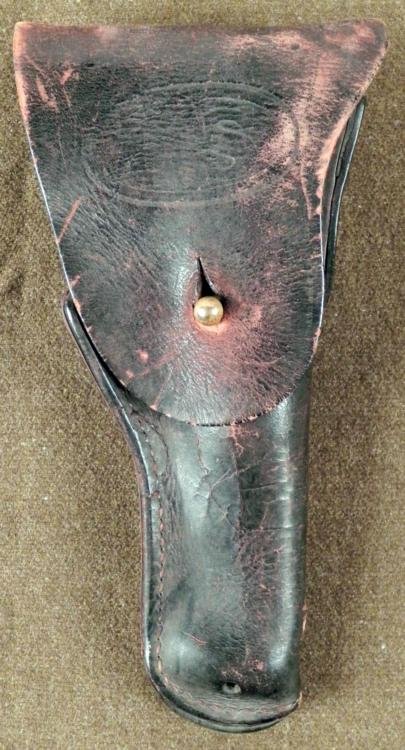 ORIGINAL WWII U.S. ARMY COLT REVOLVER HOLSTER: OFFERED HERE IS AN ORIGINAL WWII U.S. ARMY COLT REVOLVER HOLSTER BY WARREN LEATHER GOODS. THE HOLSTER HAS THE LETTERS "US" IN A DOUBLE OVAL STAMPED ON THE FRONT FLAP. THERE IS A BRASS NUB FLAP CLO