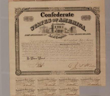 One thousand dollar six percent CSA loan certifica: One thousand dollar six percent CSA loan certificate, issued Richmond, 1863, no. 7530. Total of 7 $30 coupons attached. Large architectural vignette. Overall good condition with light foxi
