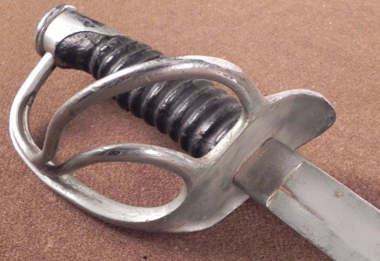 US MODEL 1860 OFFICERS LIGHT CAVALRY SABER-35 CIVIL WAR: U.S. MODEL 1860 OFFICER'S LIGHT CAVALRY SABER-35" BLADE-CIVIL WAR ERA * BRIGHT BLADE SHOWS AGE-3 BRANCH HAND GUARD-CURVED BLADE-BRIGHT TOP HARDWARE-BLACK GRIP (MISSING WIRE WRAP)-PARTIAL RICASSO STAMP