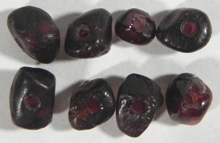 8 Ancient India Garnets Gemstones 5000 Years Old: These 8 gemstones are Indian Garnet, and they date back to over 5000 years old. They have a deep red color, and are naturally shaped. They are up to 9 mm in size.