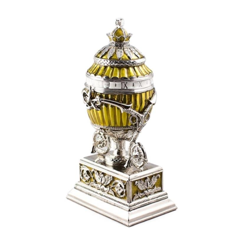 Lilly Bouquet Clock Faberge Inspired Egg: The Bouquet of Lilies Clock Egg (or the Madonna Lily Egg) is a jewelled Easter egg made under the supervision of Peter Carl Faberge in 1899 for Tsar Nicholas II as an Easter gift to his wife, the 