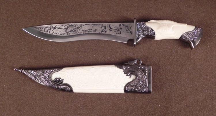 DOUBLE ENGRAVED HUNTING KNIFE EAGLE SPREAD OVER GRIP: THIS IS ONE GREAT LOOKING DECORATIVE HUNTING KNIFE/CUTLASS. IT HAS 9 3/4" LONG WIDE BLADE WITH FOREST WILDLIFE SCENES ON BOTH SIDES OF WOLVES HOWLING AT A FULL MOON, PHEASANTS, TREES. THE BLADE IS "