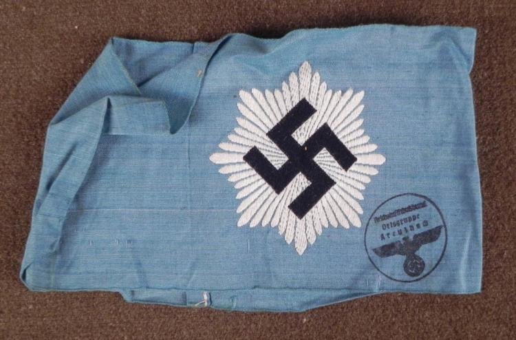 NAZI RLB ARMBAND-ORIG GERMAN AIR PROTECTIVE LEAGUE: NAZI RLB ARMBAND-ORIGINAL-GERMAN AIR PROTECTIVE LEAGUE W/OSTGRUPPE STAMP * RARE ORIGINAL BRINGBACK-ONE OF THE MOST ATTRACTIVE NAZI ARMBANDS ALSO--BLUE IN COLOR WITH A WHITE EMBROIDERED MOBILE SWASTIKA