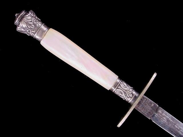 ENGLISH DIRK DAGGER MID 19TH CENTURY, mounted with: ENGLISH DIRK DAGGER MID 19TH CENTURY, mounted with a double edged blade that measures 4 inches in length. The blade is in very good condition with only some minor surface blemishes, marked wit