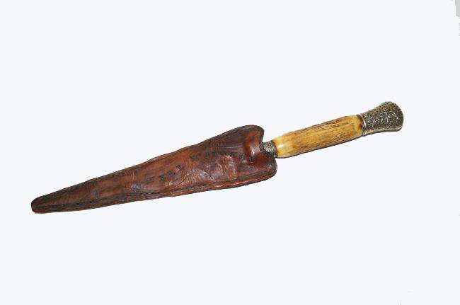 Horn & Silver Handled Knife: Rare, fine, Arkansas Toothpick knife with owner's name in the leather sheath. The handle is antler with coin silver banding. Manufactured by Landers, Frary and Clary in the last quarter of