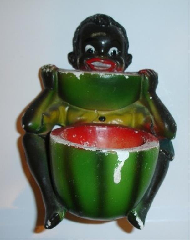Black America vintage chalkware sculpture showing: Black America vintage chalk ware sculpture showing a boy eating a watermelon. It measures 6 inches high and 3 inches deep. The watermelon is hollow and forms a very small bowl. The back is flat and is