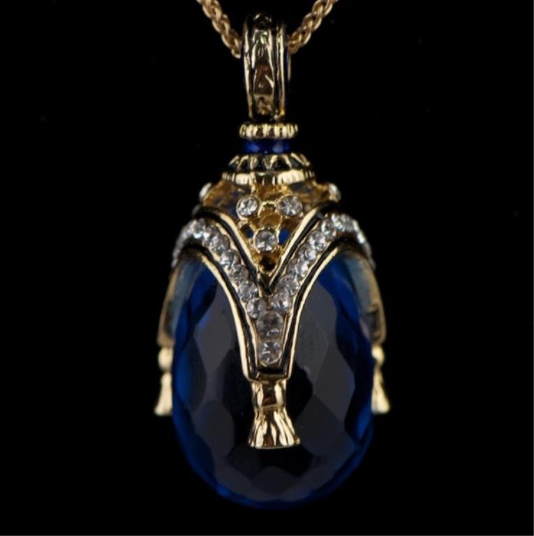 Sapphire Faberge Inspired Pendant: Faberge Inspired Pendant Elegant and grandiose, this Faberge inspired egg pendant is ready to add the extra something to complete the look of an outfit! Features: 1.25" (H) x 0.6" (D) 55 Austrian 