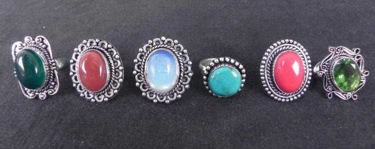 6 Sterling Rings Sapphire Emerald Garnet Ruby Moonstone: 6 Gemstone Rings * * Rings: 23mm, in Sterling Silver curled and beaded settings * * Gemstones: Turquoise, Emerald, Garnet, Ruby, Malachirte and Moonstone * Cuts: Oval, smooth and faceted * Conditions: