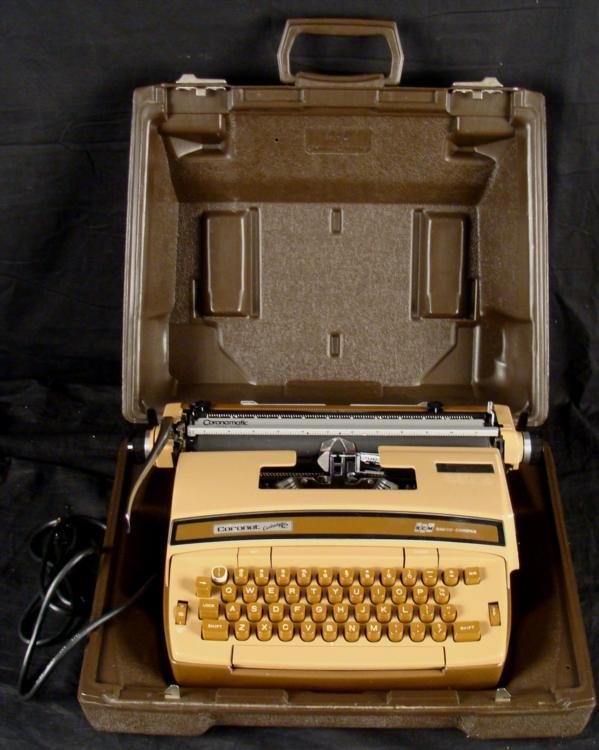Vintage Coronamatic Cartridge 12 Portable Typewriter: This is a vintage Coronamatic Cartridge 12 Portable Typewriter in the original case. This model is brown colored with dark brown case exterior. It was made in the early 1970's. It is in very good cond
