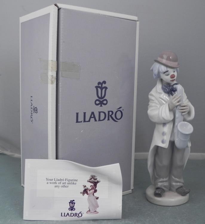 Lladro Porcelain Clown Figurine #5471 Sad Sax MIB: This Lladro figurine is a sad clown playing a sad song on his saxophone. * Title: Sad Sax * Number: 5471 * Sculptor: Francisco Catala * Year issued: 1988 * Dimensions: 8 3/4 inches tall x 3 inches wid