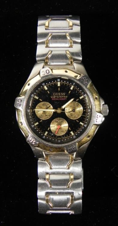 Guess Waterpro Mens Day/Date Sport Watch: This is a men's Guess Waterpro model sport wrist watch. It is in very good and running condition, with normal use wear. It features a rotating bezel. The dial is black with silver tone and luminescent