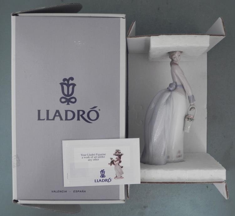Lladro Porcelain Girl Figurine #7622 Basket Of Love MIB: The basket of pink flowers this Lladro figurine lady carries is filled with love. * Title: Basket Of Love * Number: 7622 * Sculptor: Jose Puche * Year issued: 1994 * Year retired: 1996 * Dimensions: 9