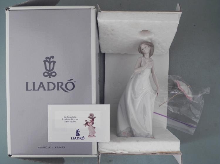 Lladro Porcelain Figurine #7636 Afternoon Promenade MIB: Here is a Lladro figurine lady strolling along on a sunny afternoon, shaded by her delicate pink parasol. * Title: Afternoon Promenade * Number: 7636 * Sculptor: Jose Puche * Year issued: 1995 * Year 