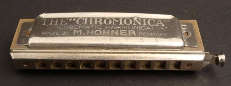Chromonica Vintage Harmonica M Hohner Germany -Key of C: This vintage Chromonica is a chromatic harmonica made by M Hohner of Germany. It features 10 holes and 40 reeds, and plays at 2 1/2 full chromatic octaves. It is in very good and clean sounding condit