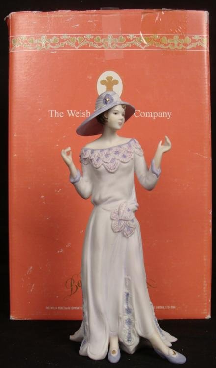 Welsh Porcelain Company Sally 1920 Flapper Girl Figure: Here is Sally, donned in a playful pale lilac gown and hat, styled after the 1920's. This figurine is part of the Charleston Collection, highlighting the fashions of the young flapper girls. She was h