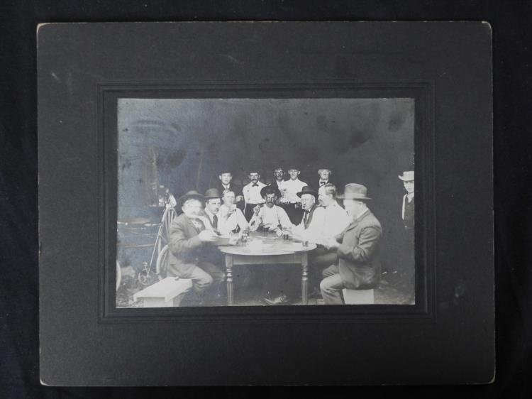 Antique Photograph Old West Poker Playing Cowboys: Here is a photographic portrait of a group of a dozen men at a poker game. A boy stands to the rightg, and a woman can be seen behind the carriage at the left. The bicycle rests in front of the carria
