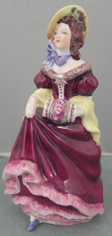 Coalport China Figurine from England -Judith Ann: This lovely figurine from Coalport of England is Judith Ann. She wears a flowing cranberry dress, and yellow hat and shawl. The underside has a maker mark. She is fine bone China, and stands 6' tall. 