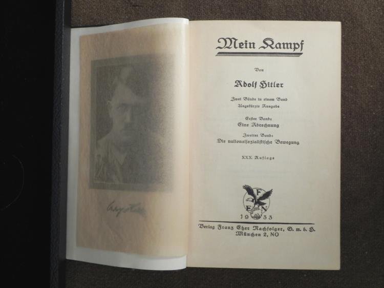 Adolf Hitler Mein Kampf Book Early Edition Nazi 1933: This is an early 1933 edition of Adolf Hitler's famous book "Mein Kampf." It was published in Munich by Berlag Franz Eber Nachfolger. It is all in German, and has a photo of Hitler to the left of the 