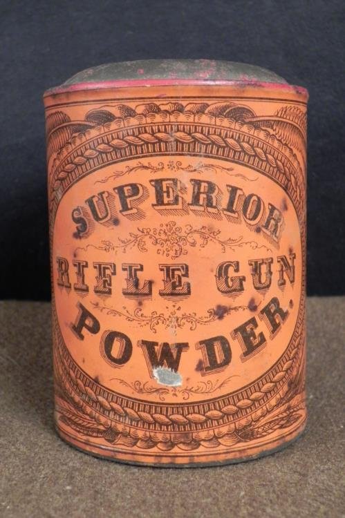 Antique Civil War Superior Rifle Gun Powder Metal Can: This cannister is from Superior Rifle Gun Powder, and we believe it dates from around the Civil War era. The dimensions are 3 1/2" x 2 1/2". It is made of steel with paper label painted dark orange, w