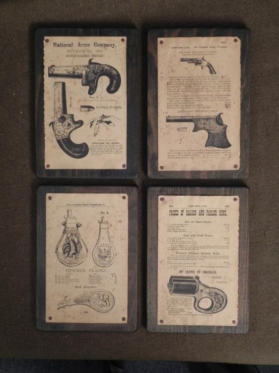 4 Antique Firearms Gun Powder Flask Advertising Plaques: Here are four antique wood plaques with firearms advertisements. These were produced by the National Firearms Company in New York. Included is a James Brown & Son (PA) covering standard revolvers,