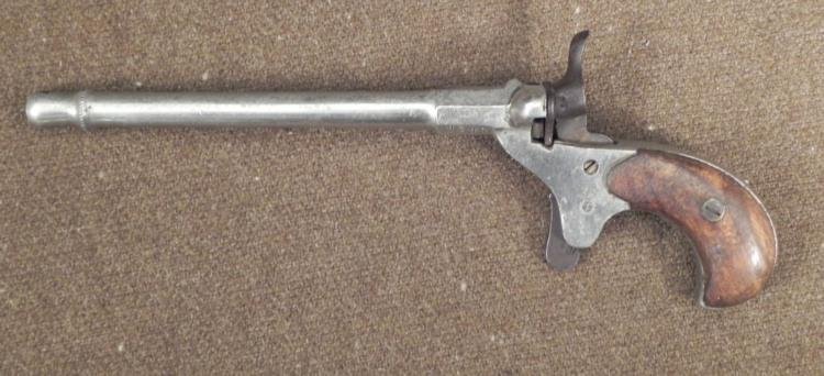 Antique English Parlor Pistol 22 Caliber Gun 1317: This is an Antique English Parlor Pistol, marked Series 1317. It is a .22 Caliber, and features wooden grips, and round barrel with decorative muzzle. English hallmarks are present on the underside. I