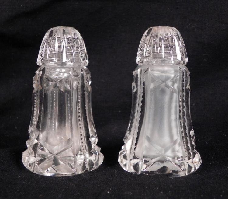 Pair of Antique Cut Glass Salt & Pepper Shakers: This pair of antique salt and pepper shakers dates back to the very early 20th century. These are cut glass or crystal, with nice designs, and frosted glass on the interior, creating a nice look. Each