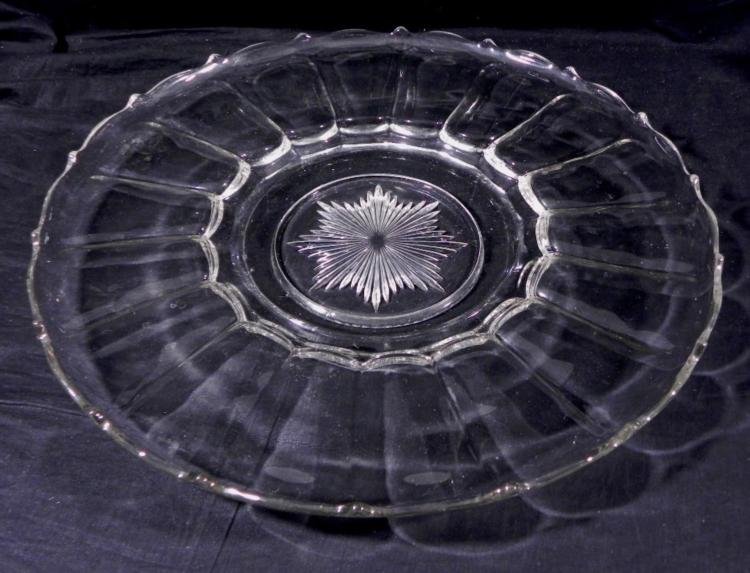 Large Round 21 In. Serving Plate Platter Vintage: This is a very large vintage crystal round serving plate, 21" in diameter. It is clear, with starburst design at the center, and points along the rounded rim. It is in very good condition, with some s