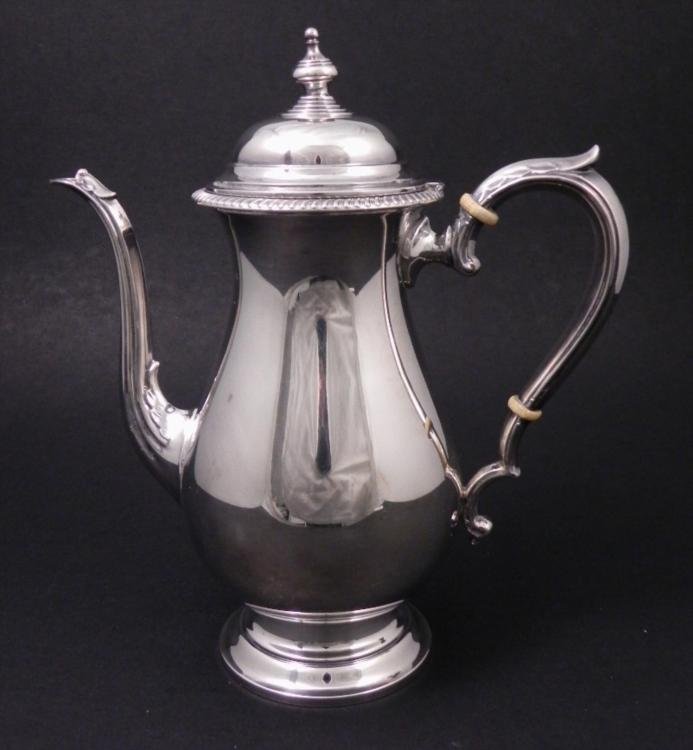 Kent Sterling Silver Teapot Vintage Hallmarked 1501: This Kent sterling silver tea pot has a feathered handle and spount, and layered circle design at the base of the finial tip. The underside has crown and shield hallmarks, and maker name and number 15