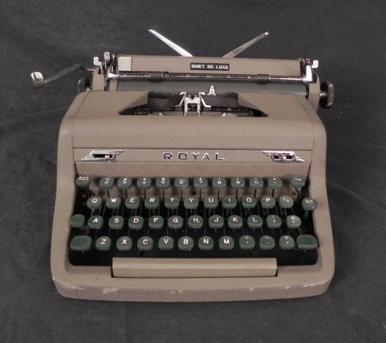 Royal Quiet De Luxe Typewriter w/ Magic Margin: Here is a Royal brand Quiet De Luxe model vintage Manual Typewriter. This model features Red, White and Black settings, and the trademarked Magic Margin. The keys are sticking sometimes, but they stri