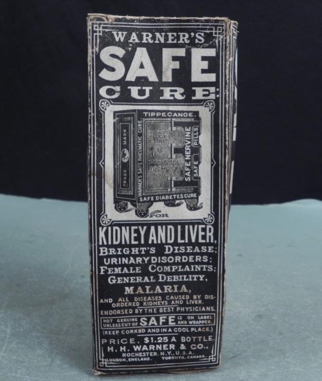 Warners Safe Cure Antique Medicine Bottle w/ Box: This antique bottle from Warners Safe Cure includes the very rare original cardboard box. The bottle is dark amber glass, with raised lettering and trademark image of a safe. The dimensions are 9 1/2 
